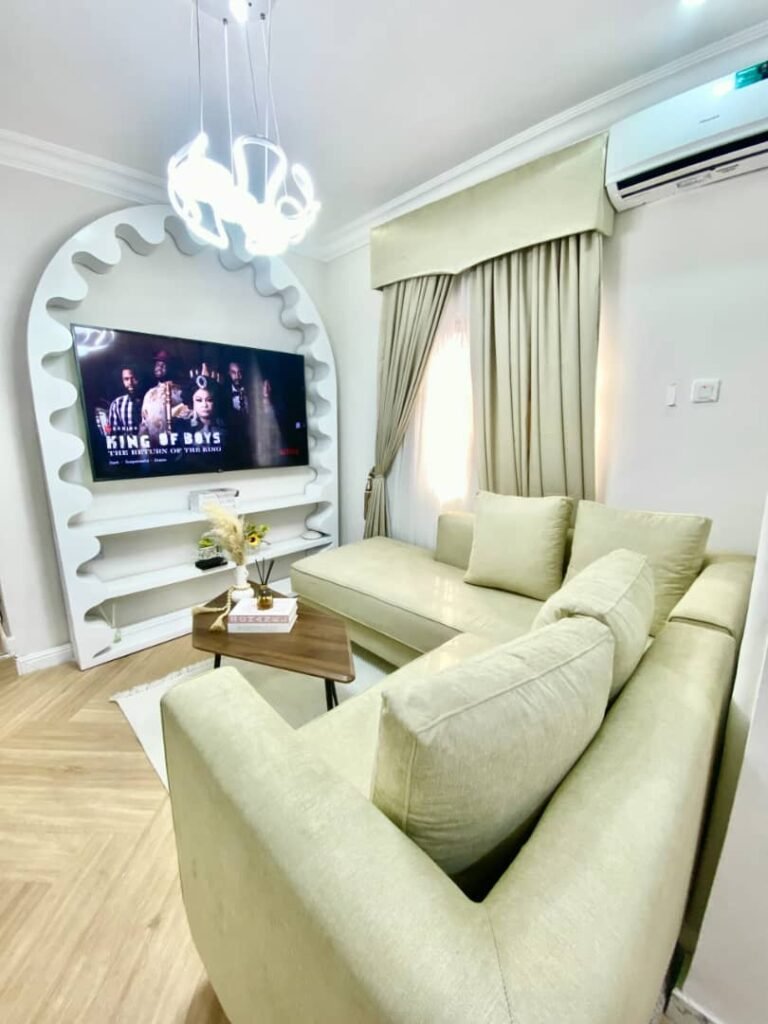 Bright luxury living room in a spacious balcony one-bedroom apartment in Lekki Phase 1