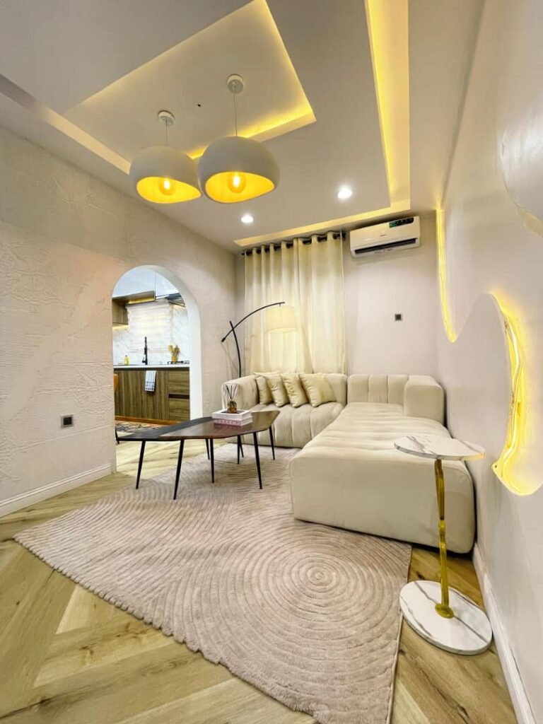 Bright luxury living room with modern sofa and elegant lighting in a Lekki Phase 1 one-bedroom apartment