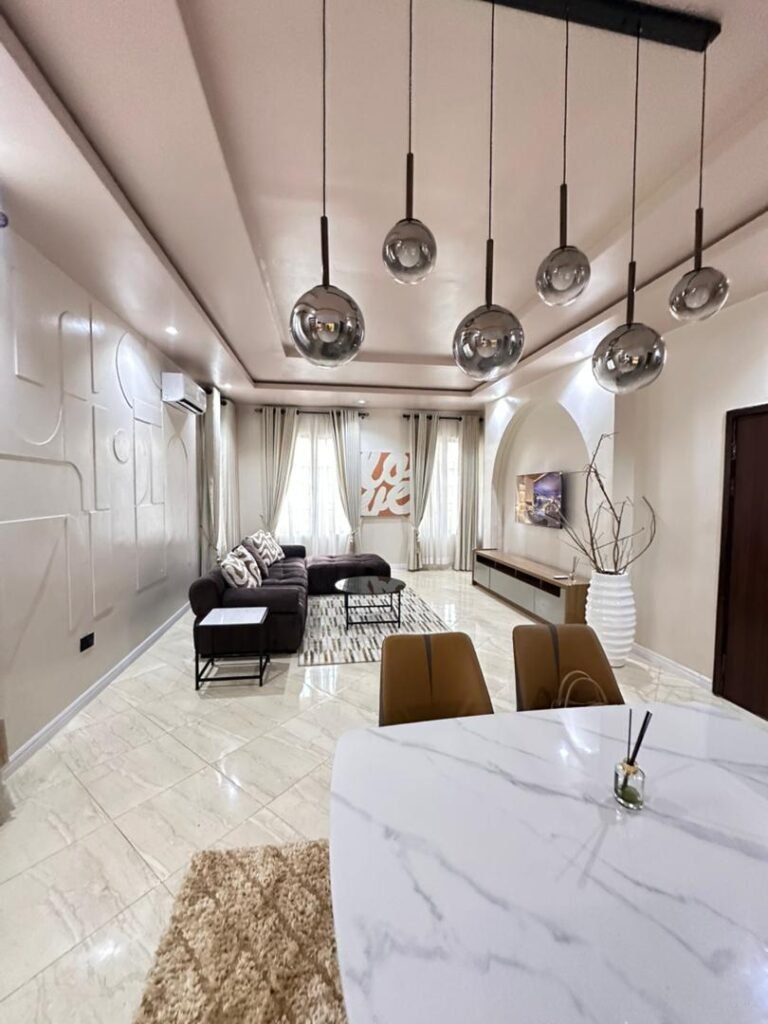 Modern interior of a luxury one-bedroom apartment in Ikoyi featuring stylish pendant lighting and elegant décor.